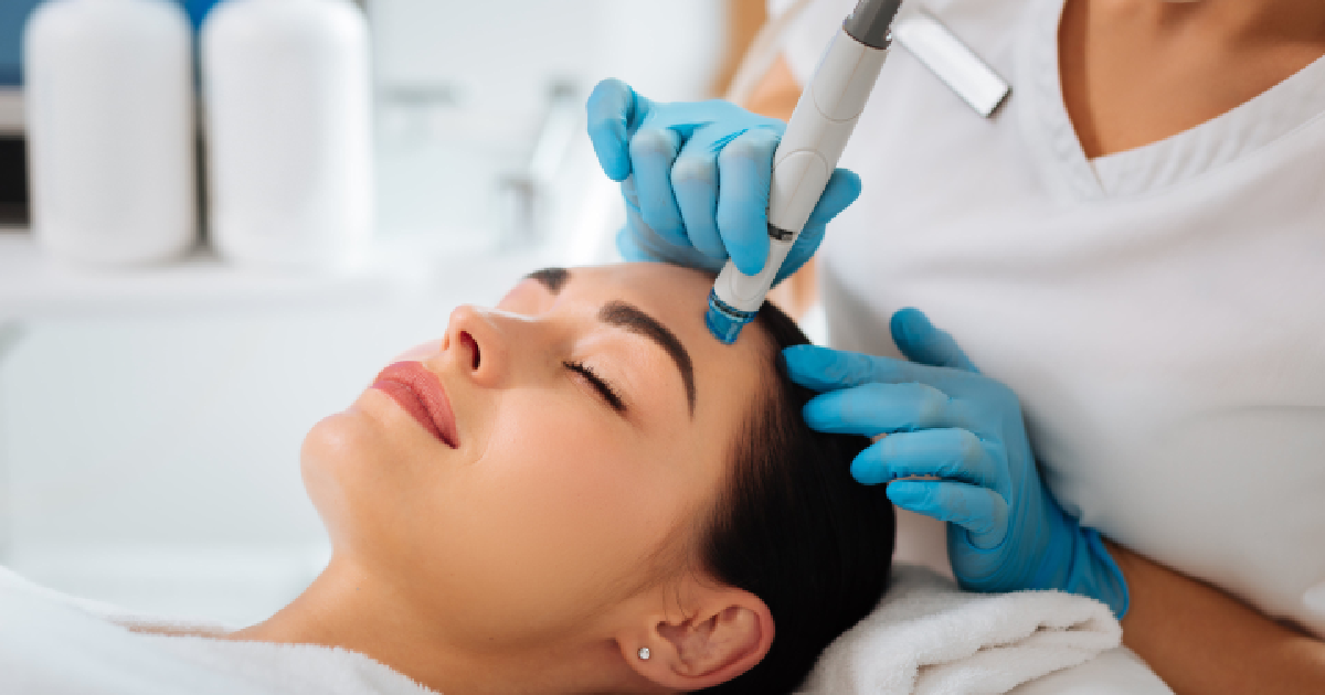 A woman receiving a HydraFacial treatment in Royal Oak, MI